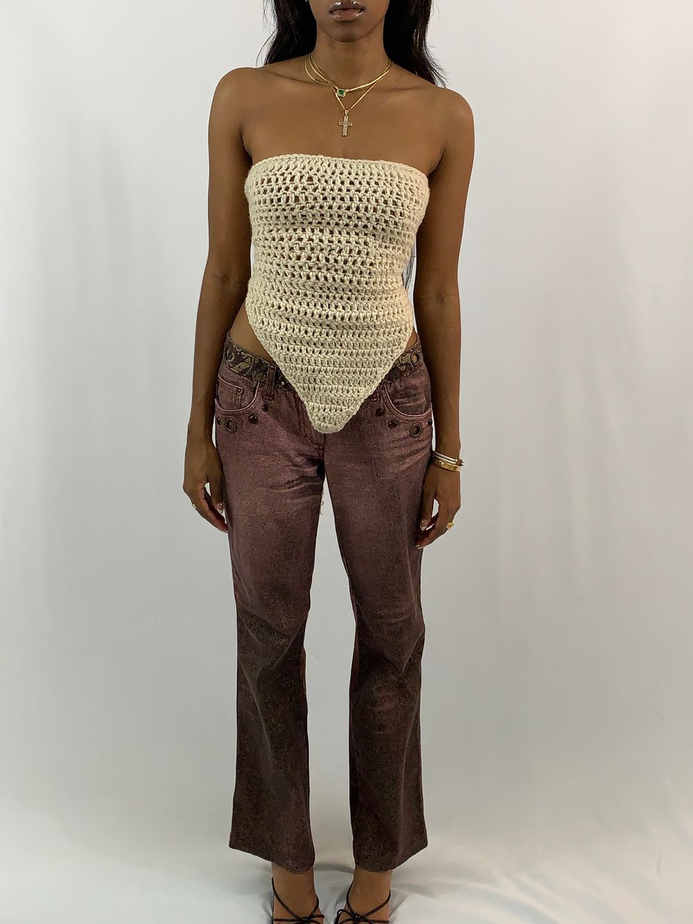 Misha wearing a cream hand-crocheted tube top with a pointed hem